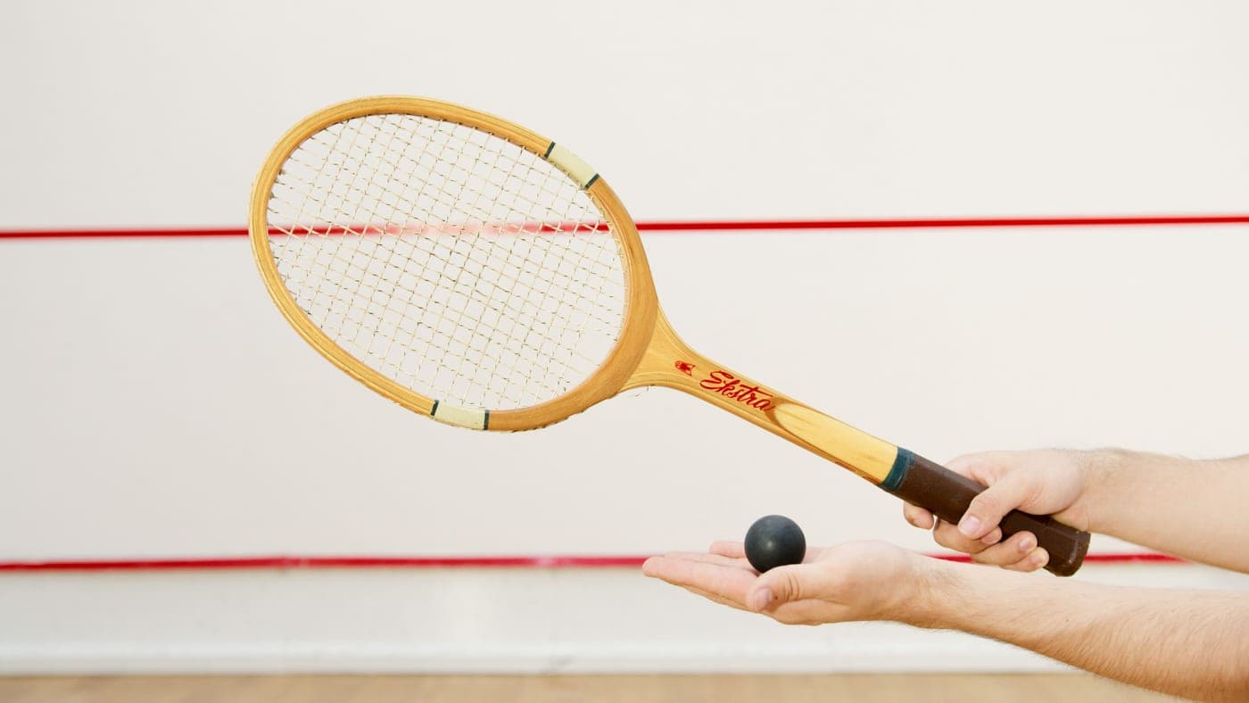 The front wall of an indoor racquetball court