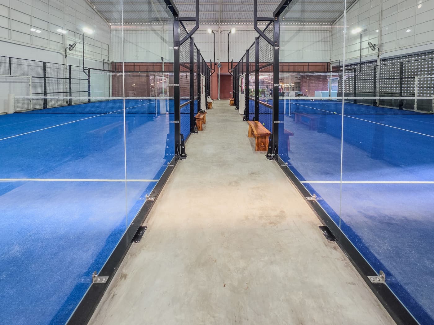 A padel court and a tennis court seen from above