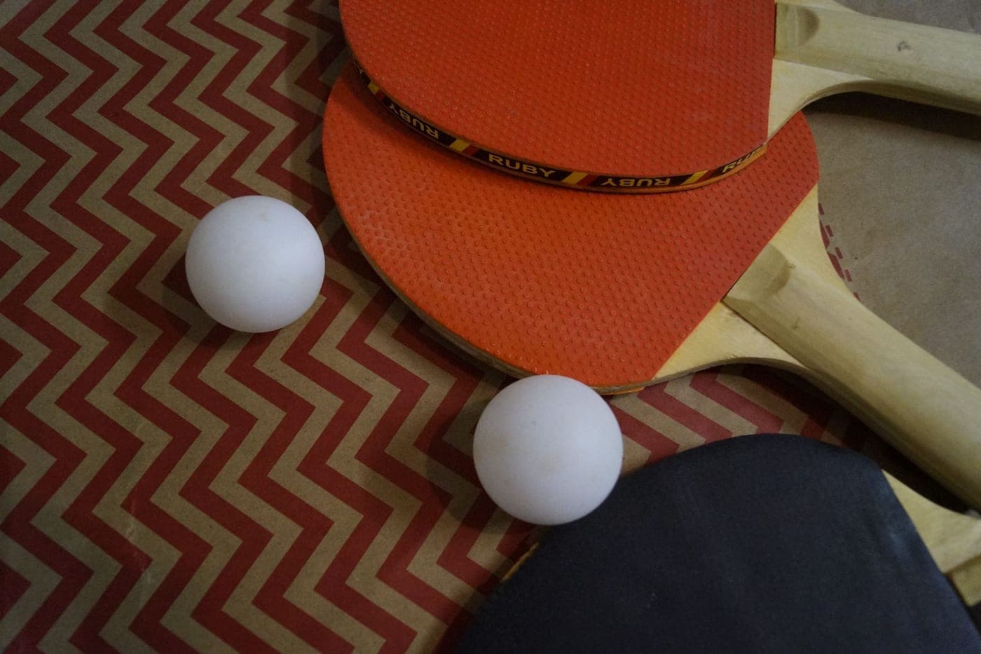 An overgrip being wrapped around a racket handle