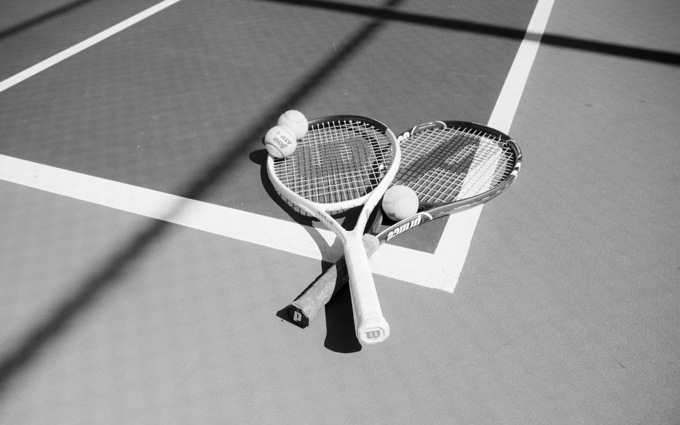 A rack of tennis rackets in a specialist store