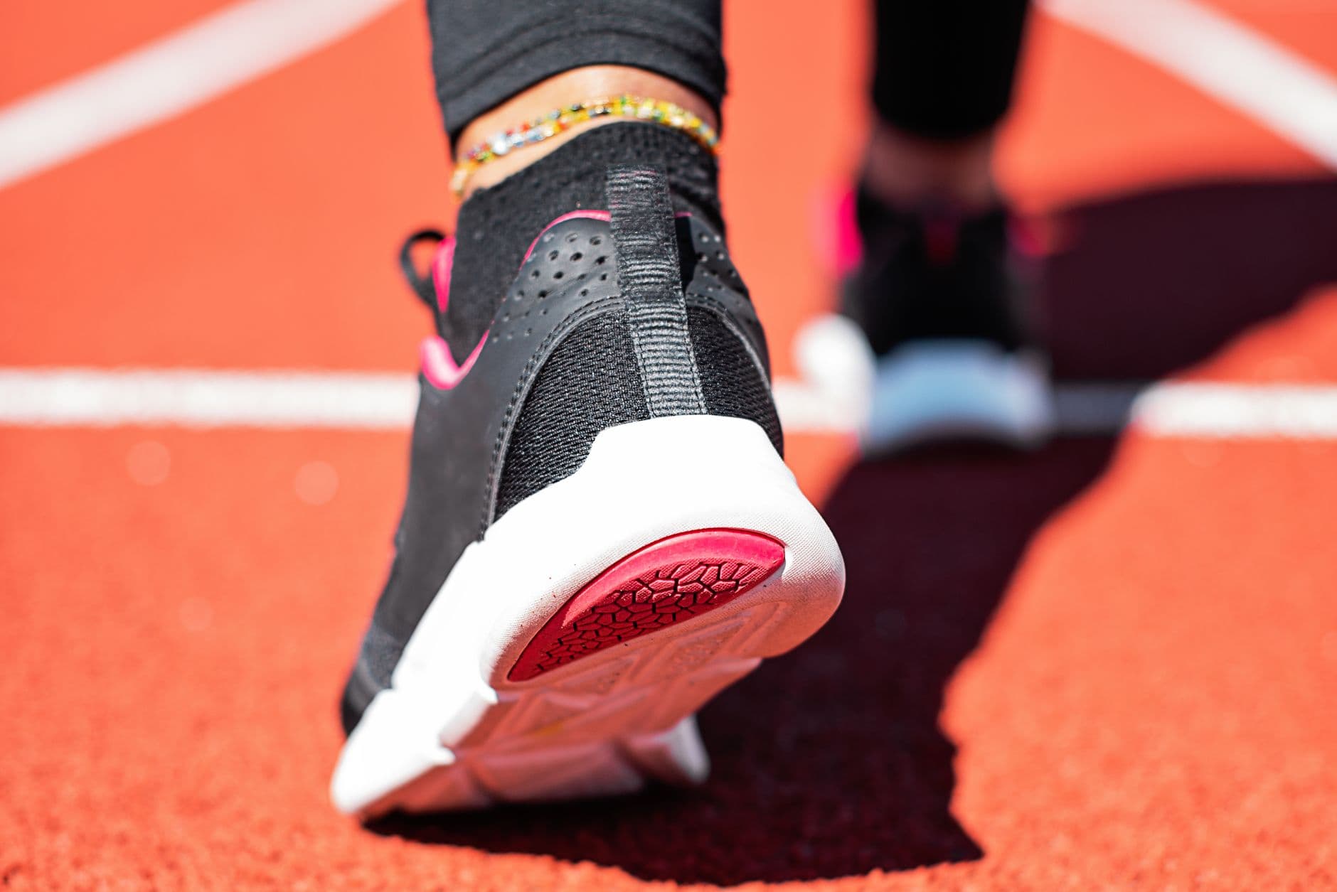 The worn outsole of a sports shoe seen from below