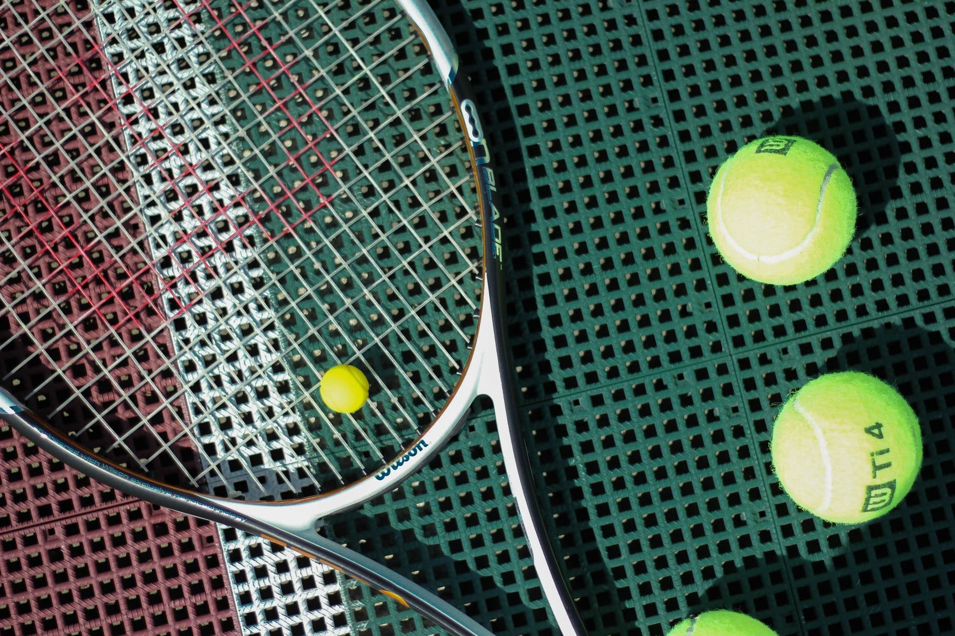 The string pattern of a tennis racket seen close up