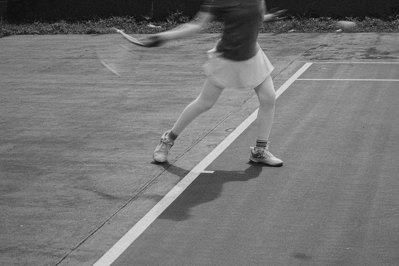 A player planting hard to change direction on a court