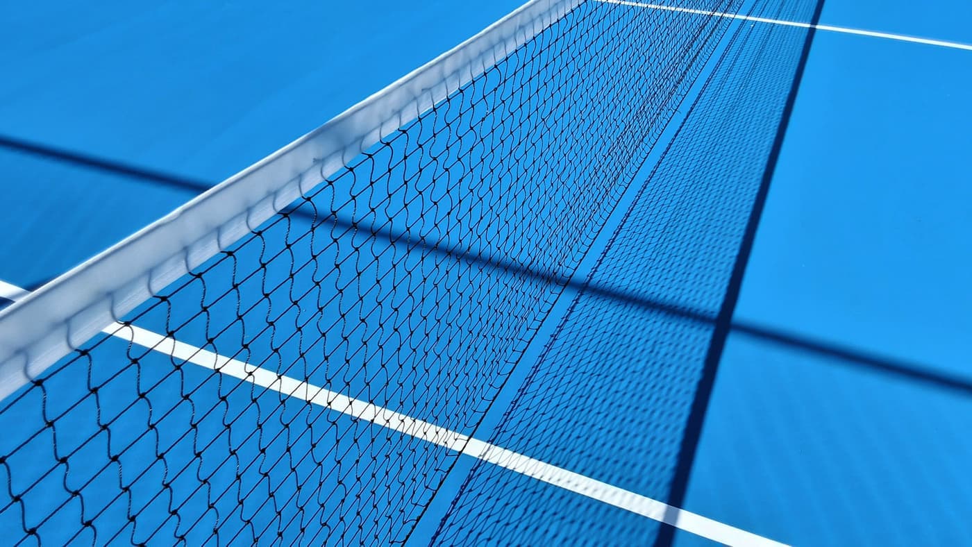 Court shoes on the blue paint of an outdoor hard court